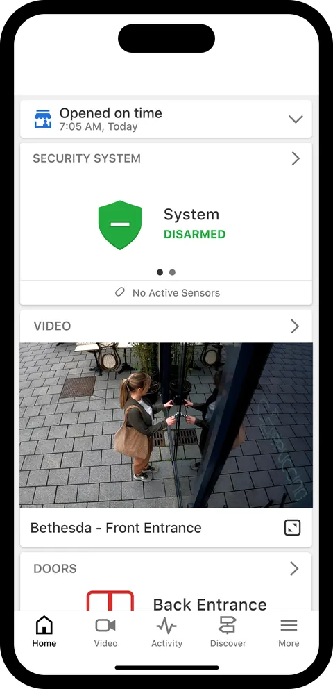 Alarm.com app business dashboard showing security system status, a front entrance camera and door controls