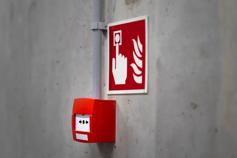 Fire alarm pull station on a wall